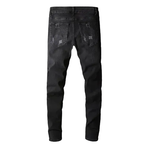Pantalon vaquero negro rasgado con detalles de cachemira