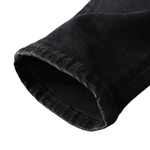 Pantalon vaquero negro rasgado con detalles de cachemira