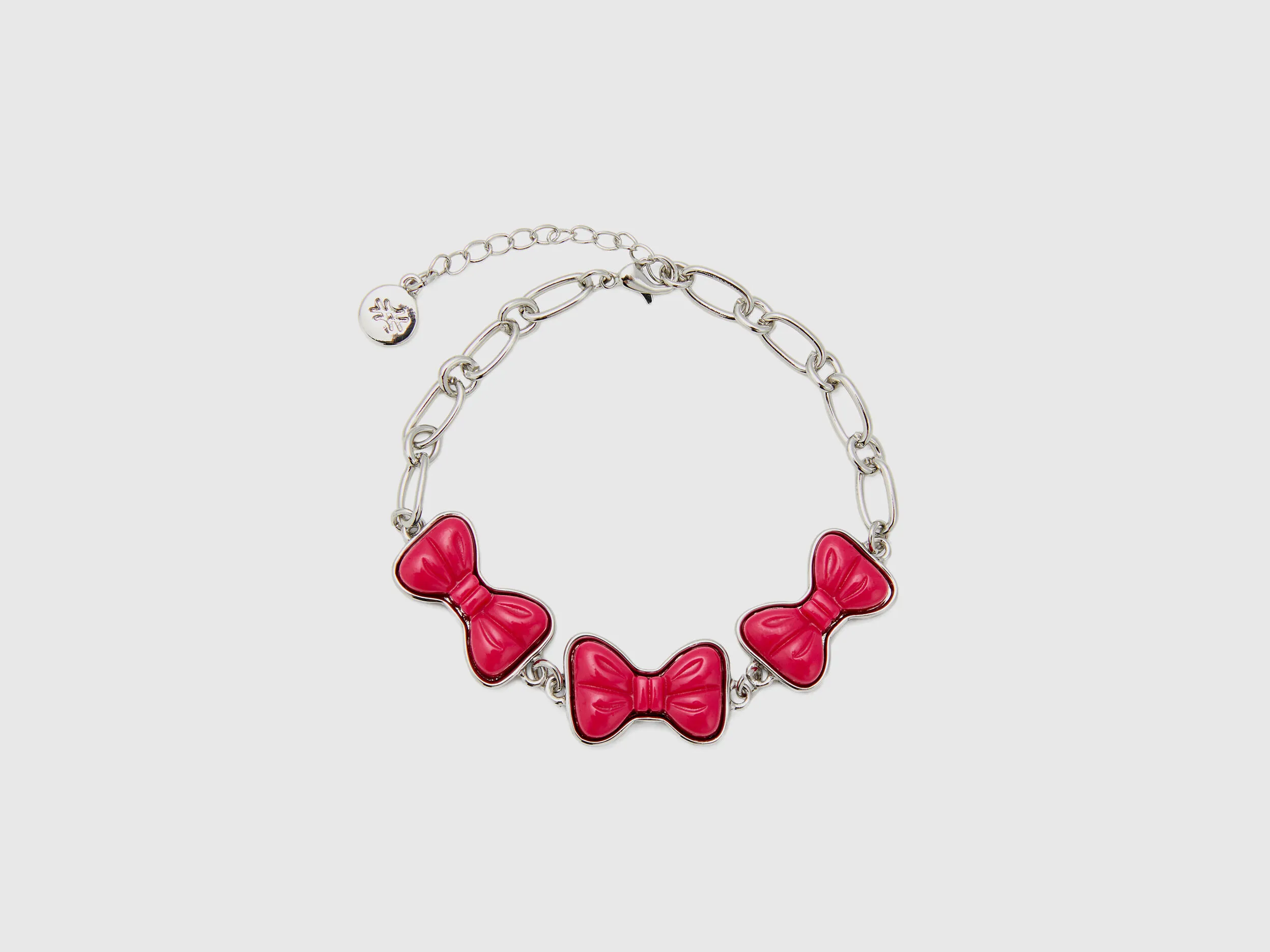 Pulsera con lazos fucsias