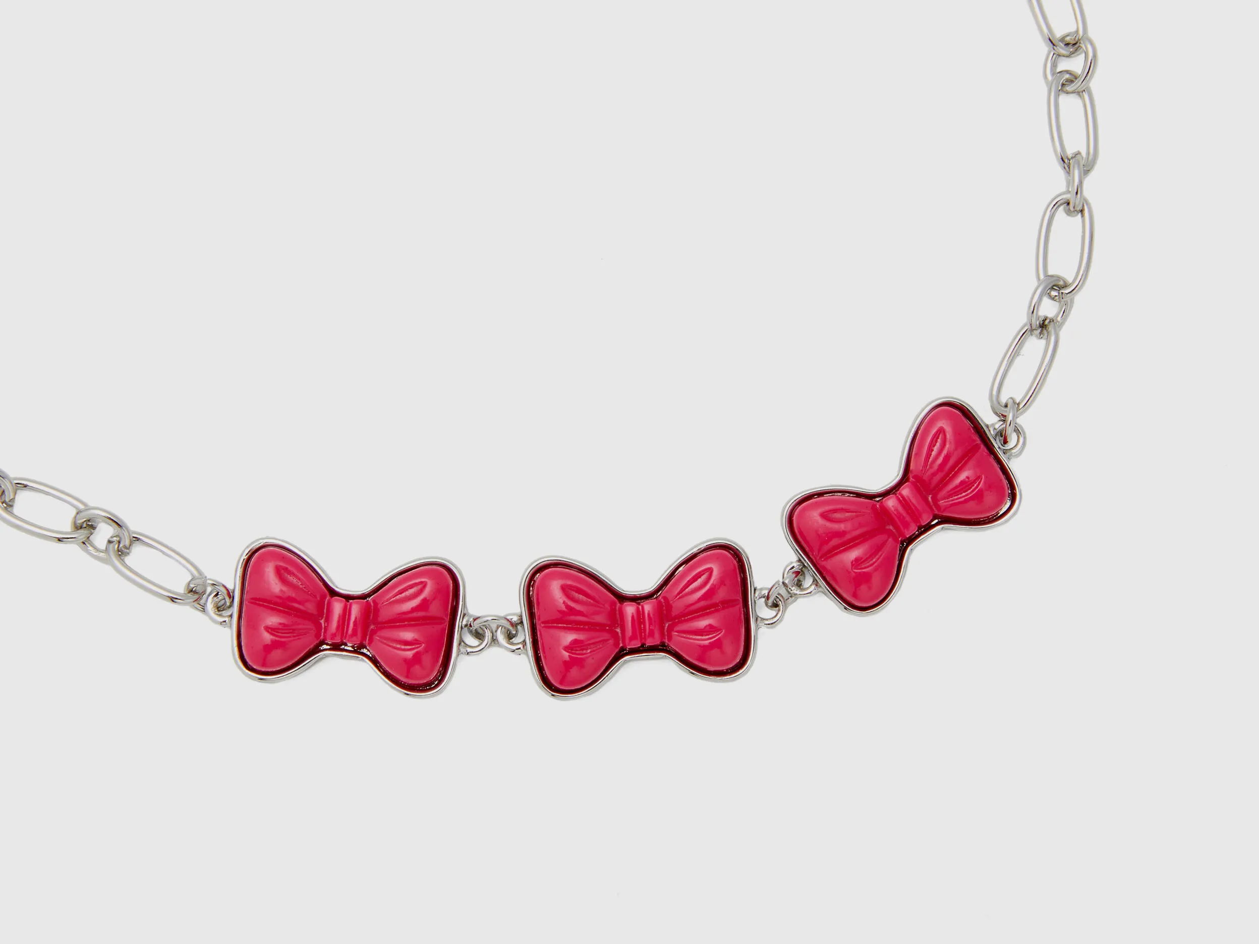 Pulsera con lazos fucsias
